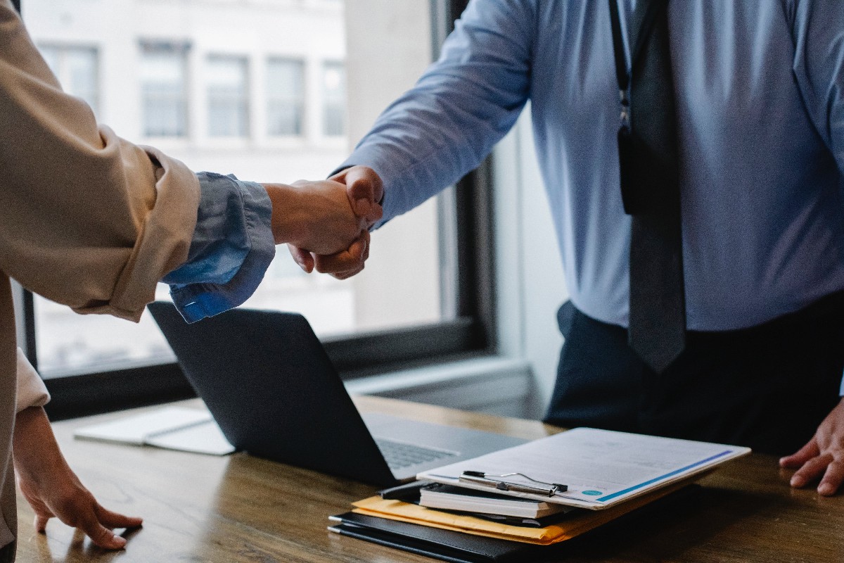 Photo of a handshake in a formal business meeting